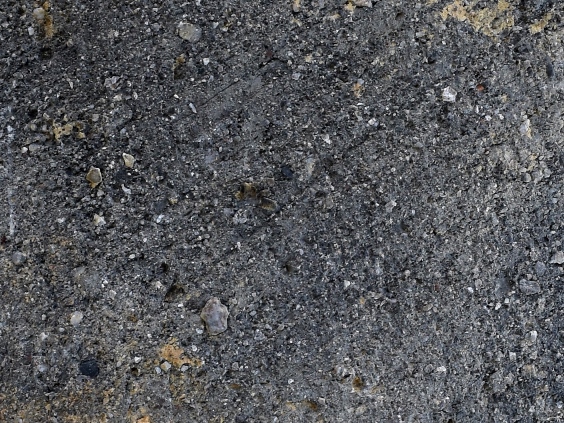 平安時代12世紀初頭の平瓦の表面に残る離れ砂の写真